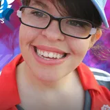 Kathryn smiling in a blue cap